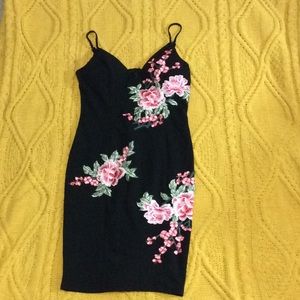 Cute black sewed in flowers body-con mini dress
